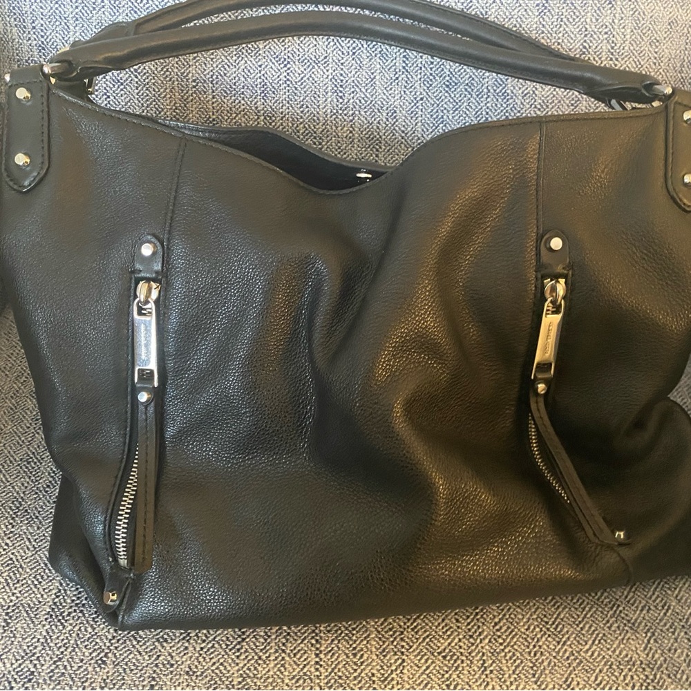 Michael Kors black leather slouch bag.